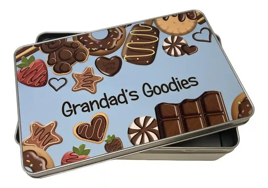 Tin box with 'Grandad's Goodies' text and chocolate-themed design on a light blue background