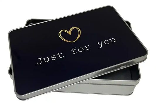 Black tin box with 'Just for You' text and  Gold heart on a white background