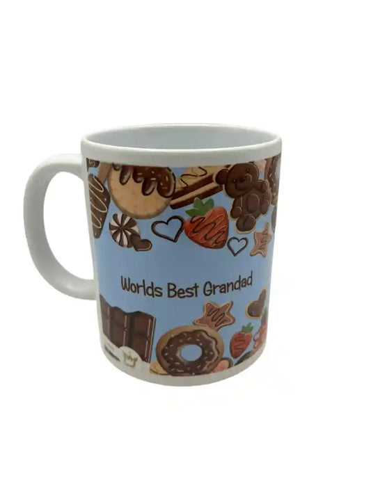 Mug with dessert-themed design and 'Worlds Best Grandad' text on a blue background